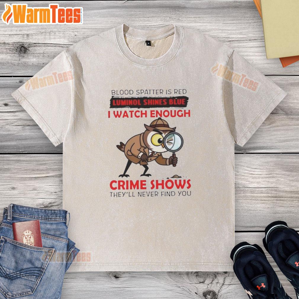 Red blood spatter design on a black t-shirt with blue luminol effect, inspired by crime shows. Official Owl shirt.