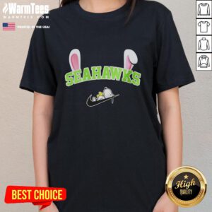 Alt Text: Official Seattle Seahawks x Snoopy Happy Easter ladies tee featuring festive design and team colors.