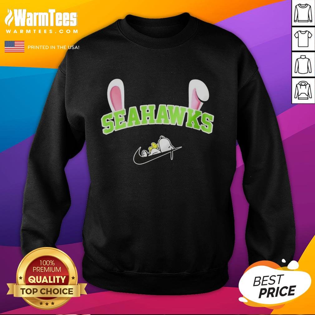 Alt Text: Official Seattle Seahawks x Snoopy Happy Easter sweatshirt featuring festive graphics and team colors, perfect for fans.