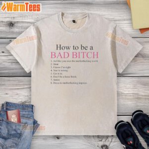 Alt Text: Stylish washed t-shirt with 'How To Be A Bad Bitch' print, embodying confidence and empowerment in fashion.