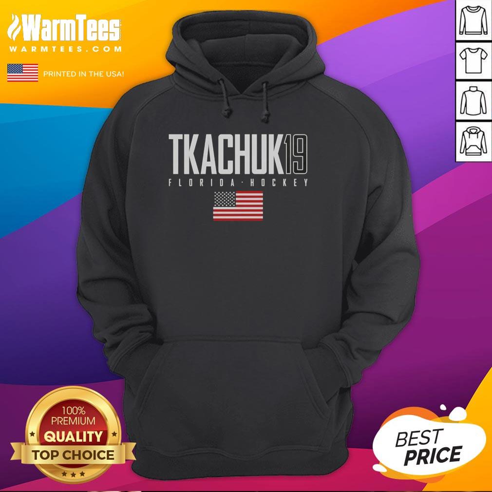 Alt Text: Cute Matthew Tkachuk in a Florida Panthers hoodie featuring the USA flag, showcasing team spirit and style.