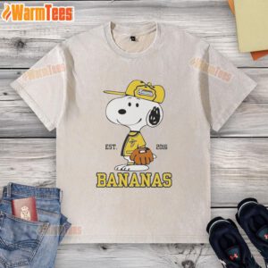 Cute Snoopy wearing a Savannah Bananas outfit on a washed t-shirt, established in 2016, perfect for fans.