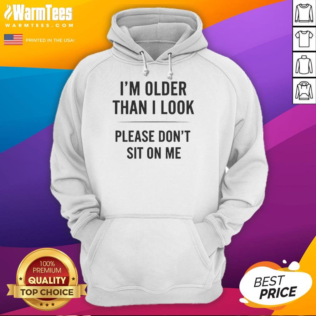 Funny hoodie with 'I'm older than I look, please don't sit on me' text design, perfect for casual wear and humor lovers.