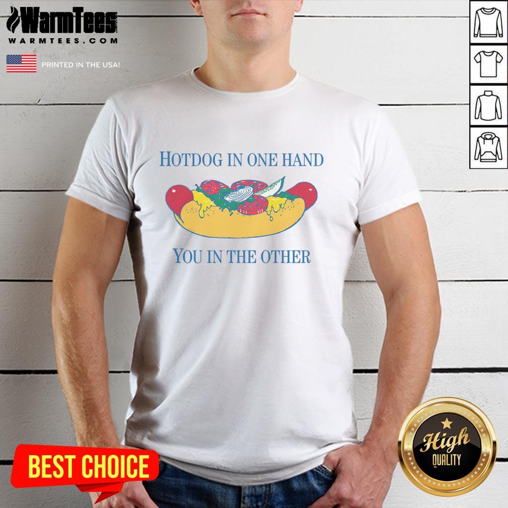 Alt Text: Person wearing 'Nice Hotdog In One Hand You In The Other' T-shirt, showcasing a fun food-themed design.
