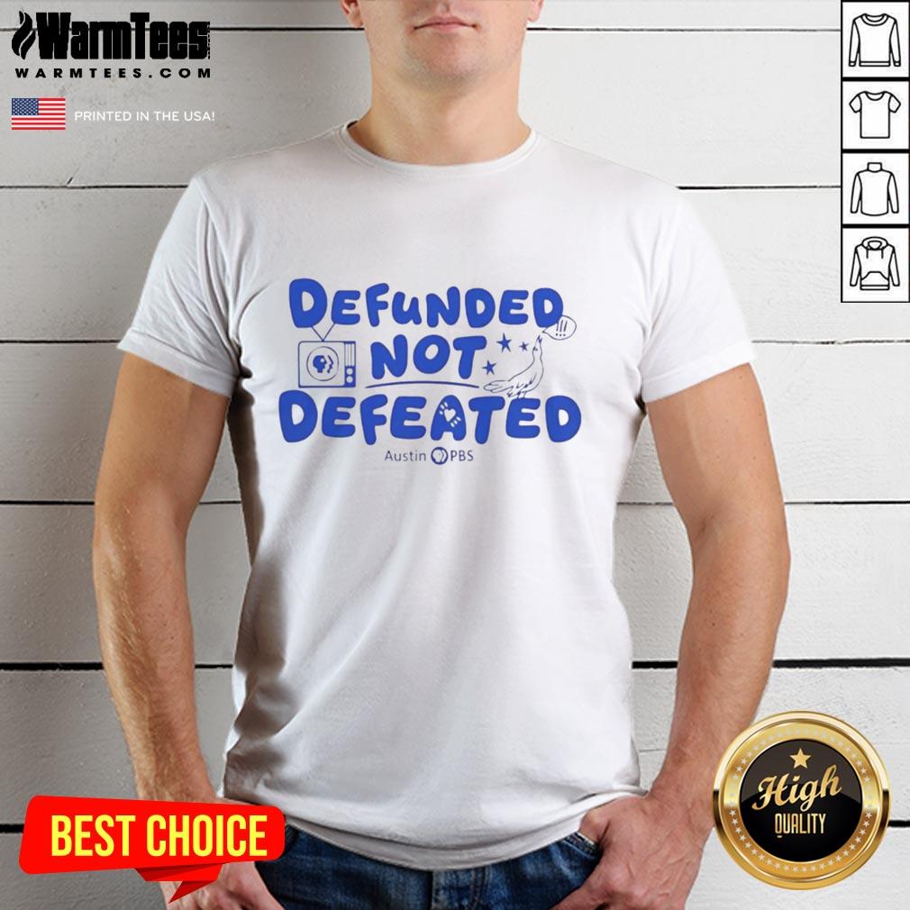 Premium Defunded Not Defeated Austin PBS slogan T-shirt showcasing bold text design on a stylish fit.