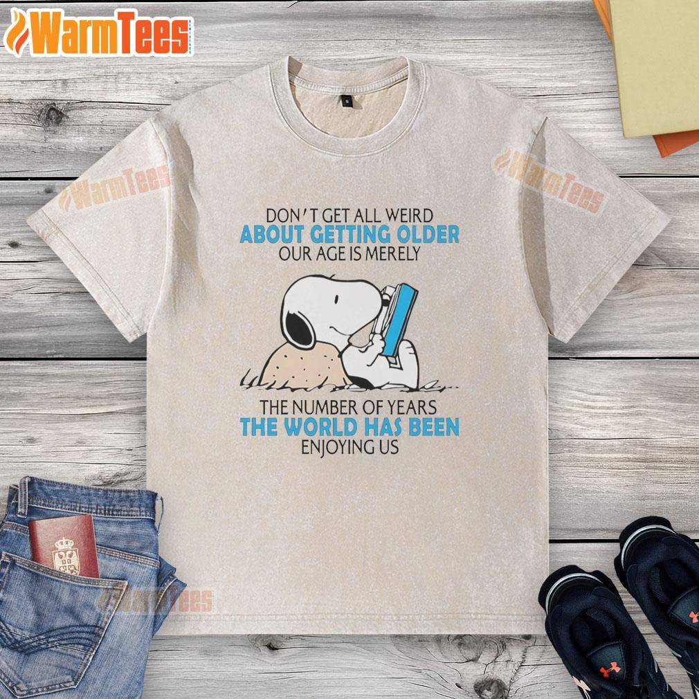 Top Snoopy t-shirt with 'Don't Get All Weird About Getting Older' print, showcasing a playful design for aging fans.