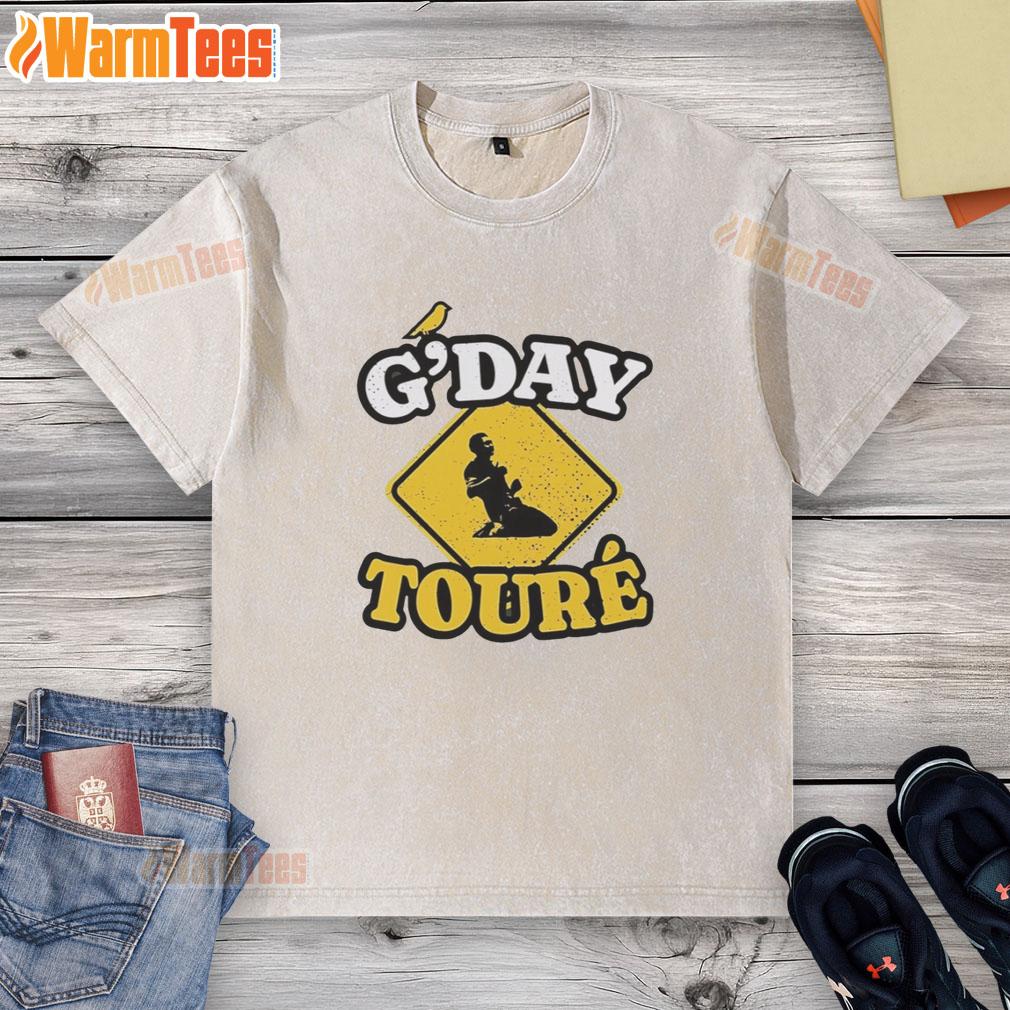 Awesome Mo Toure of Norwich City G'day Toure vintage washed t-shirt displayed on a wooden background.