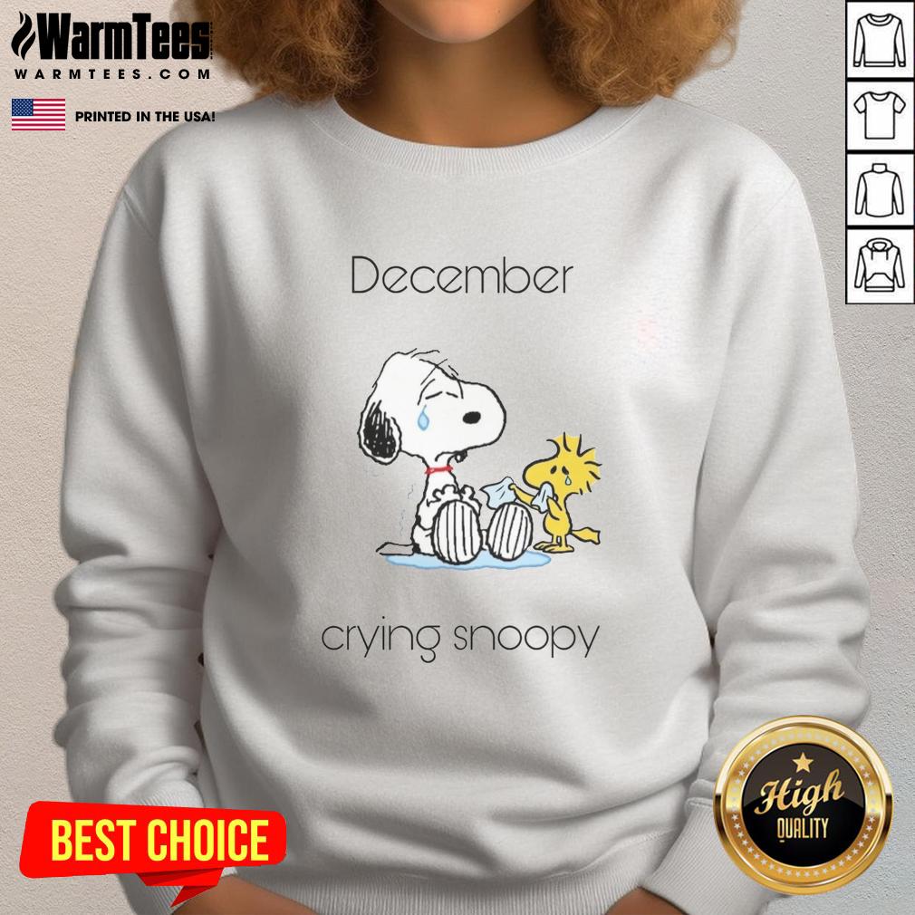 Alt Text: Adorable December sweatshirt featuring a crying Snoopy and Woodstock, perfect for cozy winter style.