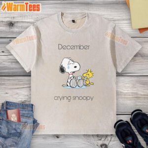 Alt Text: Cute December crying Snoopy and Woodstock graphic on a washed t-shirt, perfect for holiday cheer and Peanuts fans.
