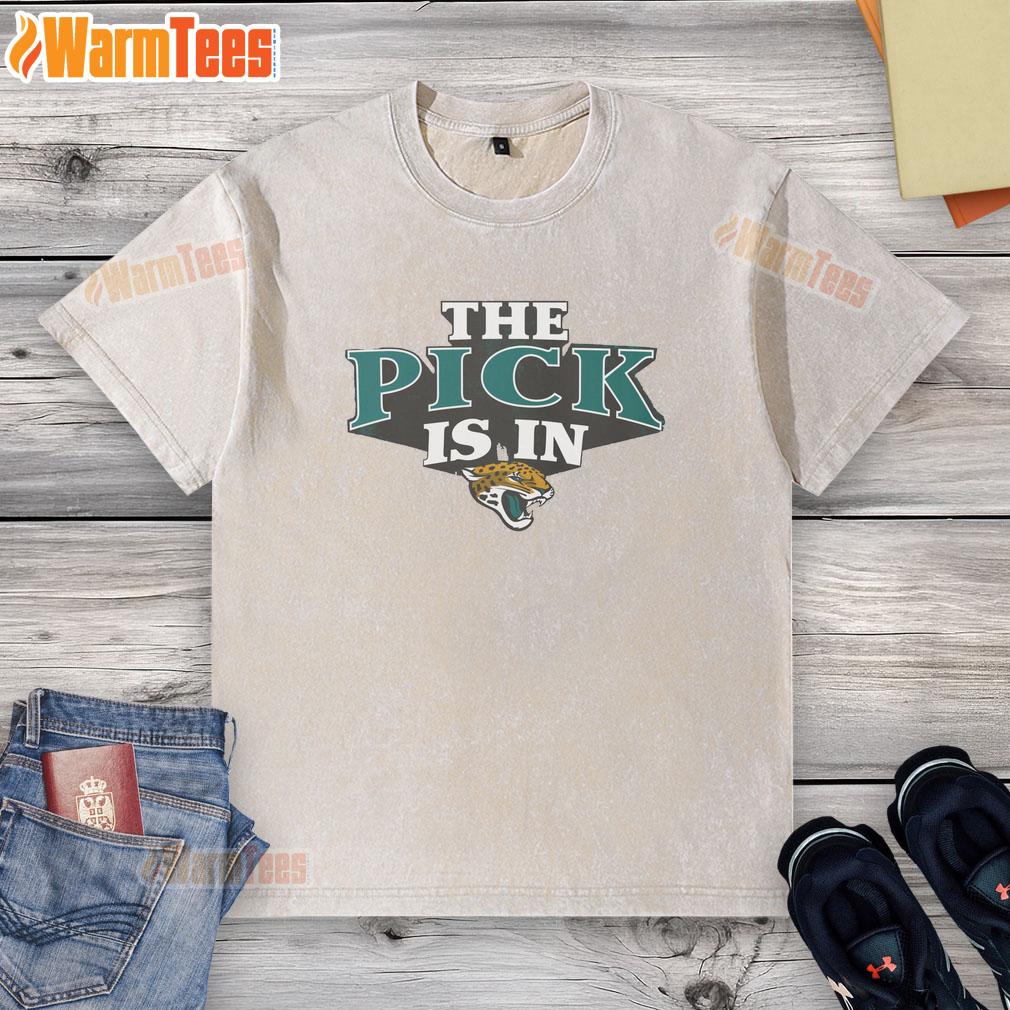Alt Text: Hot Jacksonville Jaguars pick is in washed t-shirt featuring team logo, perfect for fans celebrating the draft.