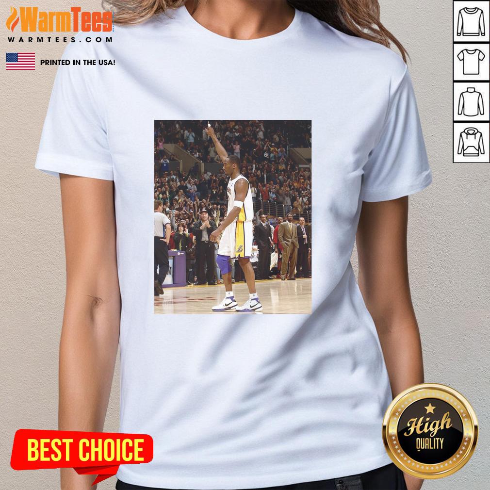 Pau Gasol wearing a Kobe Bryant ladies tee, showcasing his style and honoring the Lakers legend in a vibrant setting.