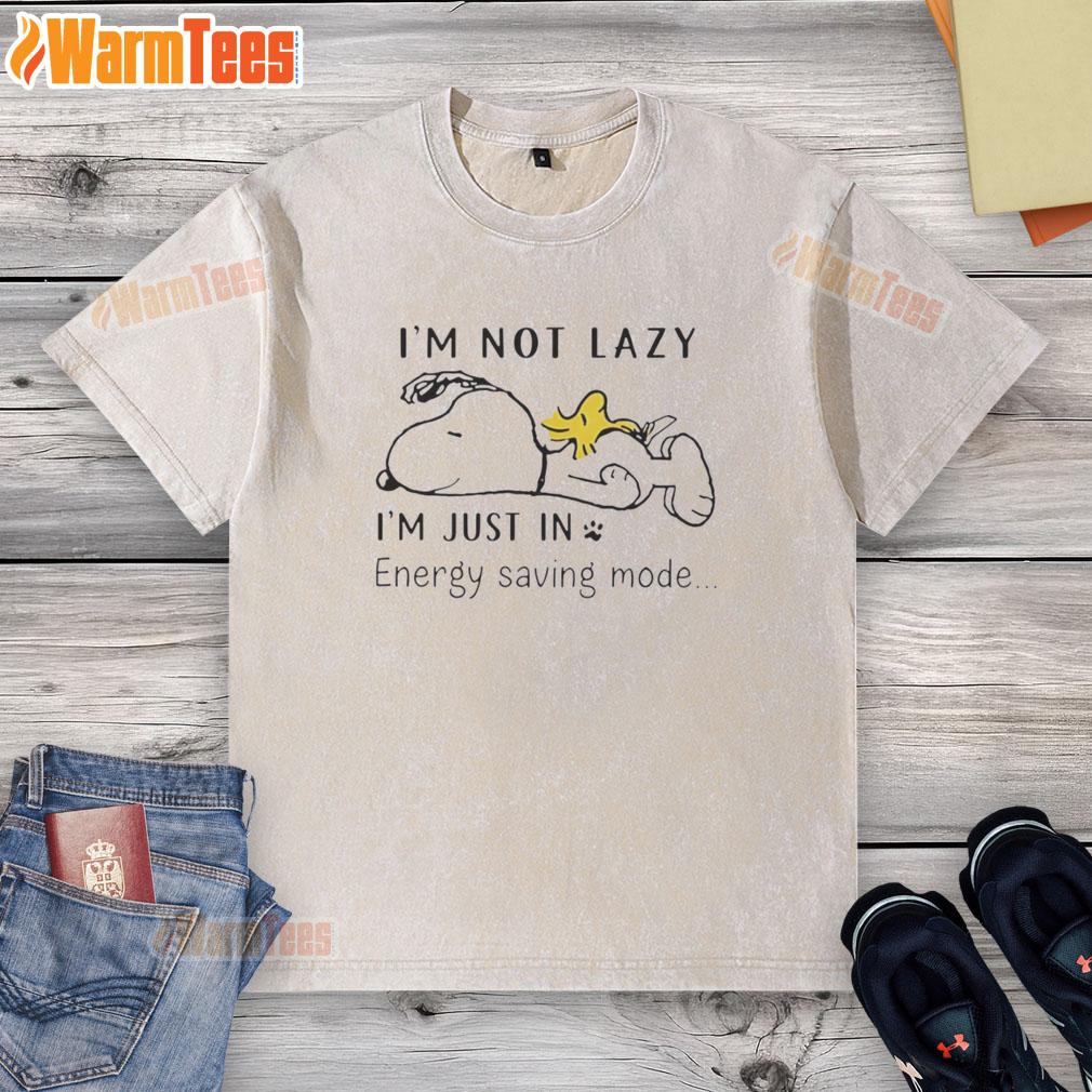 Alt Text: Cozy washed T-shirt featuring Snoopy and Woodstock sleeping with the phrase I'm not lazy, I'm just in energy saving mode.