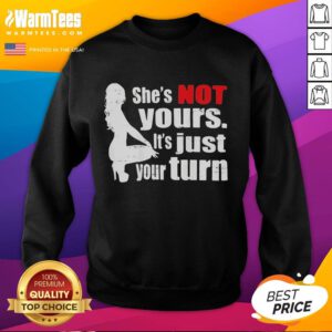 Premium 'The Woman Squatting She's Not Yours It's Just Your Turn' sweatshirt displayed on a model, featuring stylish design.