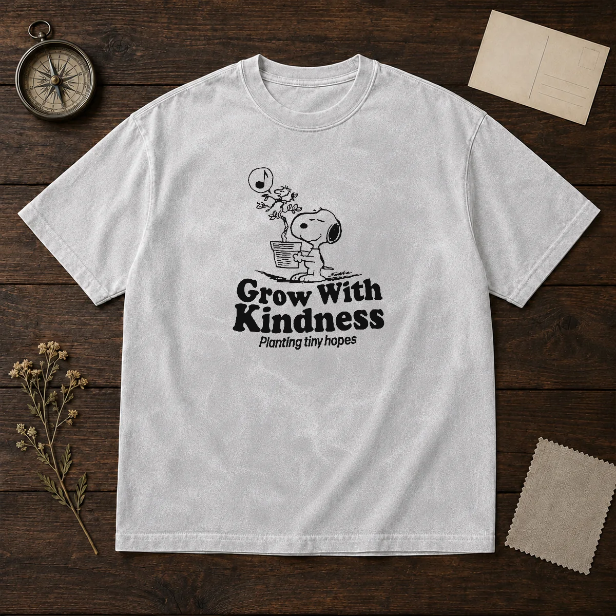 Awesome Snoopy Grow With Kindness Planting Tiny Hopes washed t shirt showing front design on soft fabric