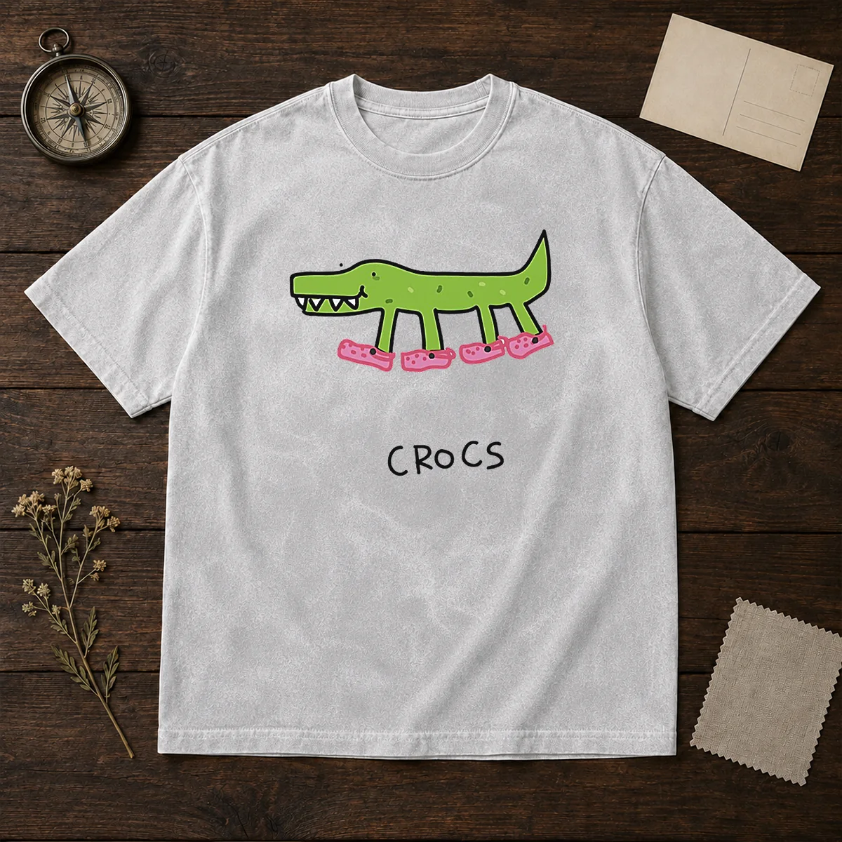 Funny Crocs Crocodile Wearing Pink Shoes Drawing on a soft washed t shirt in light gray