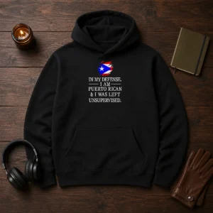 Good Puerto Rican In My Defense I Am Puerto Rican And I Was Left Unsupervised Hoodie in black, front view with bold white text