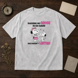 Good Snoopy Belle Peanuts Raising My Mom Is So Hard She Doesn'T Listen printed on a soft washed t shirt in white