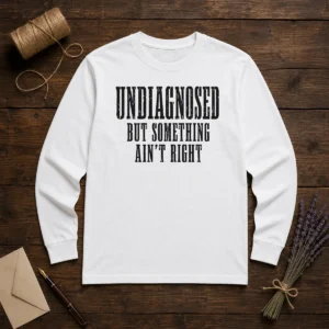 Good Undiagnosed But Something Ain'T Right Chronic Illness long sleeve shirt in white, front view with clear text design