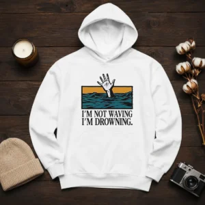 Hot I'M Not Waving I'M Drowning Hoodie in black, featuring bold white text on the front, displayed on a front-facing model