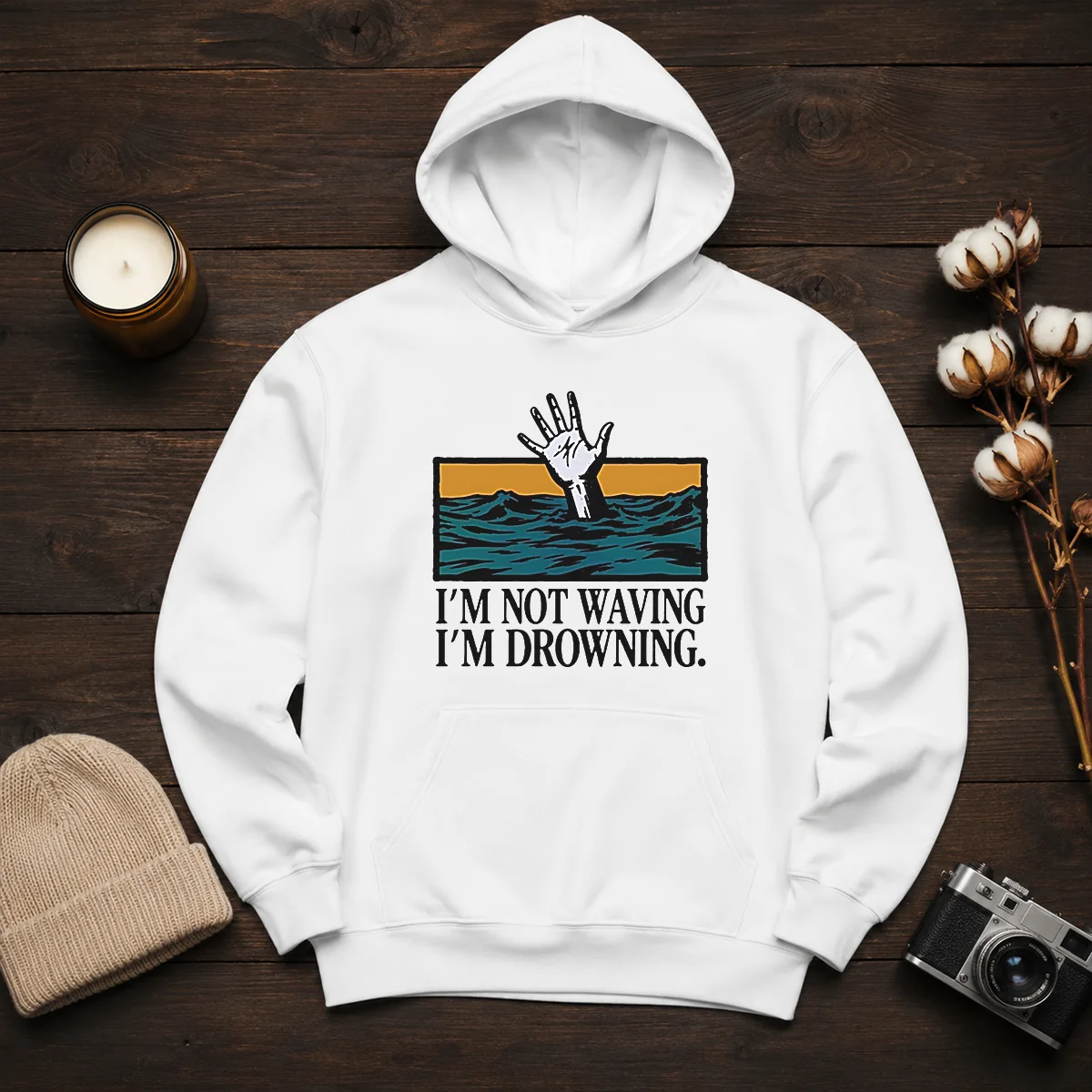 Hot I'M Not Waving I'M Drowning Hoodie in black, featuring bold white text on the front, displayed on a front-facing model