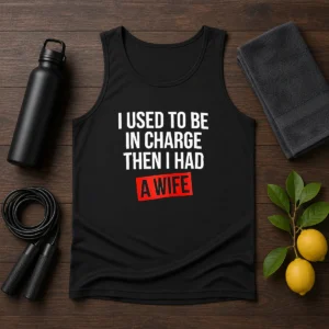 Hot I Used To Be In Charge Then I Had A Wife tank top in black with bold white text, sleeveless casual wear