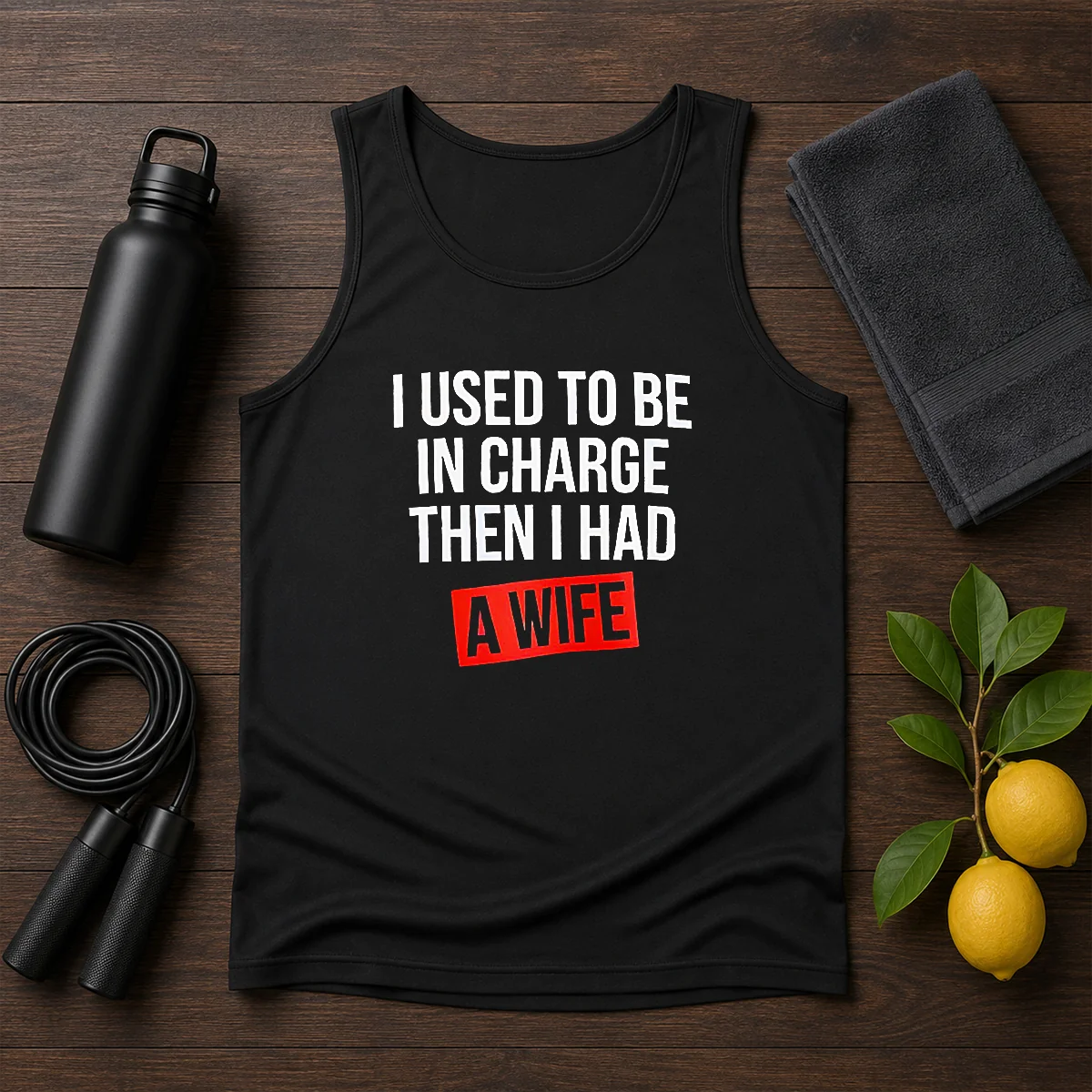 Hot I Used To Be In Charge Then I Had A Wife tank top in black with bold white text, sleeveless casual wear