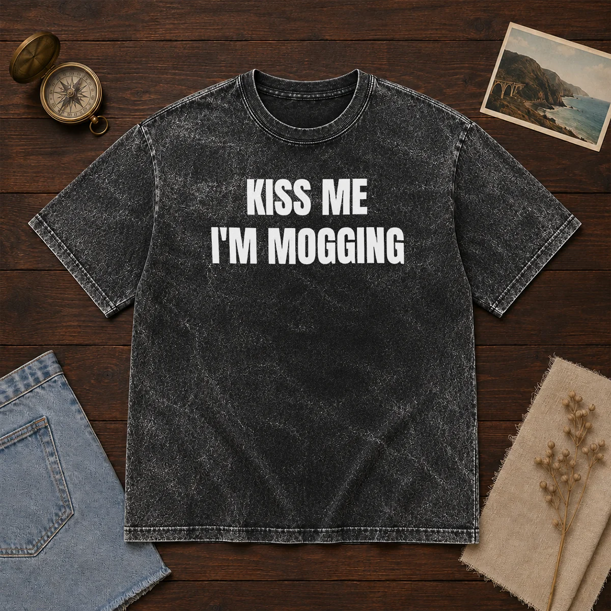 Hot Kiss Me I'M Mogging Looksmaxxing Meme printed on a soft washed cotton t shirt in light grey