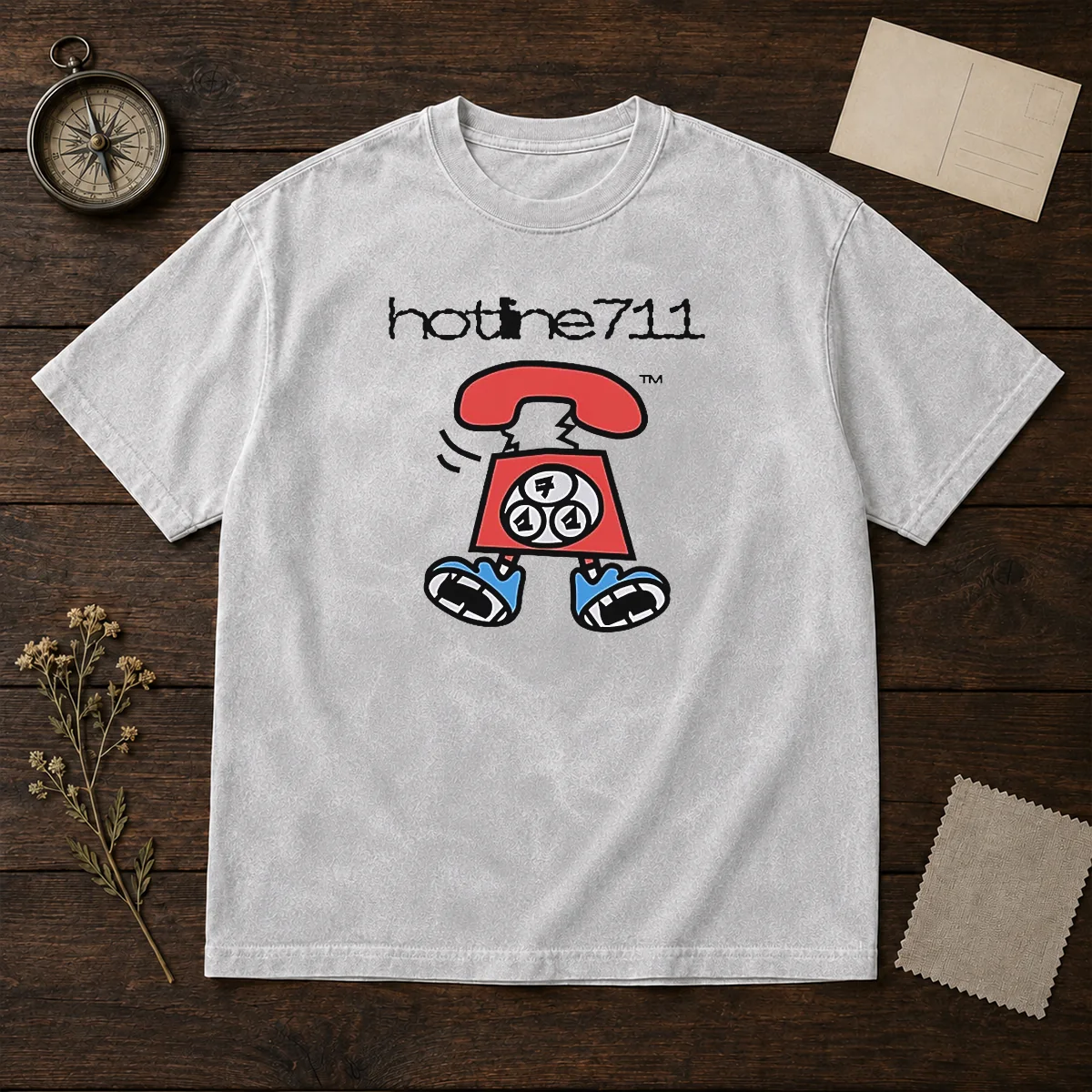 Original Telephone Cartoon Hotline711 washed t shirt showing front print design on soft cotton fabric