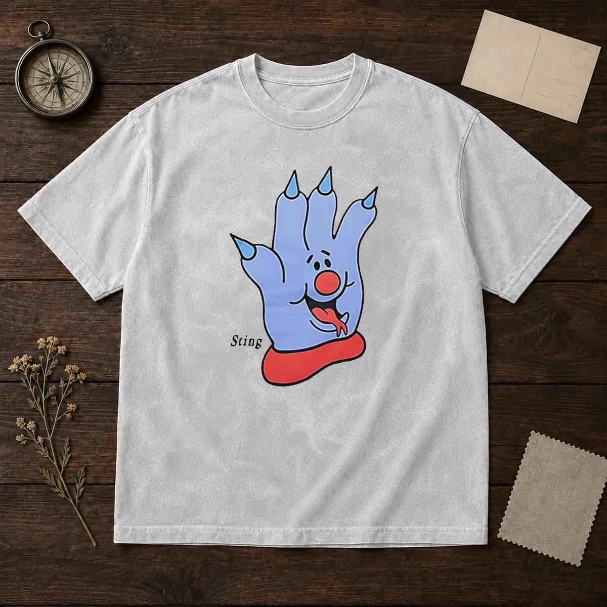 Premium Sting Blue Cartoon Hand Character Mascot printed on a soft washed t shirt in blue