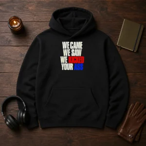 Top We Came We Saw We Kicked Your Ass Hoodie in black, front view with kangaroo pocket and drawstring hood